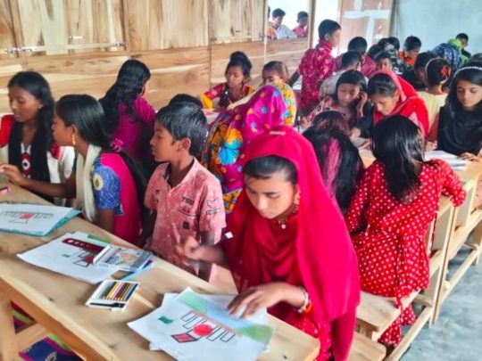 Children studying in a classroom in Bangladesh.